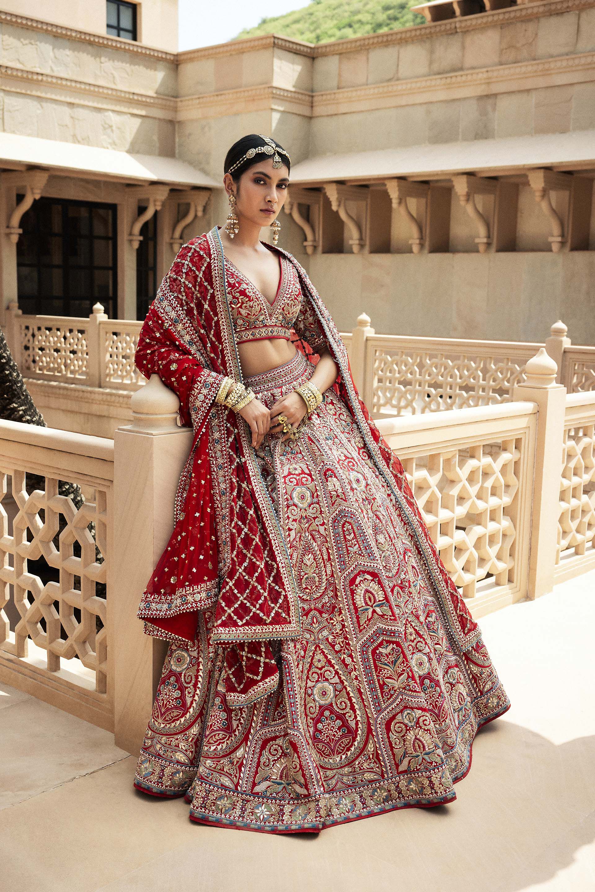 Photo of Simple bridal lehenga with red blouse and gold skirt